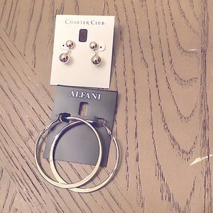 Silver tone earrings.  Two pairs